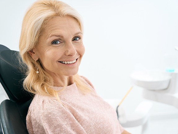 Woman smiling in the dental chair