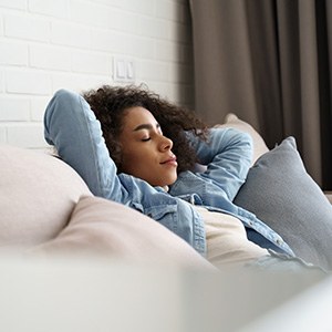 Woman resting at home on her couch