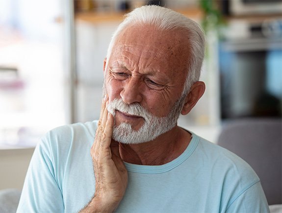 Senior man experiencing dental pain